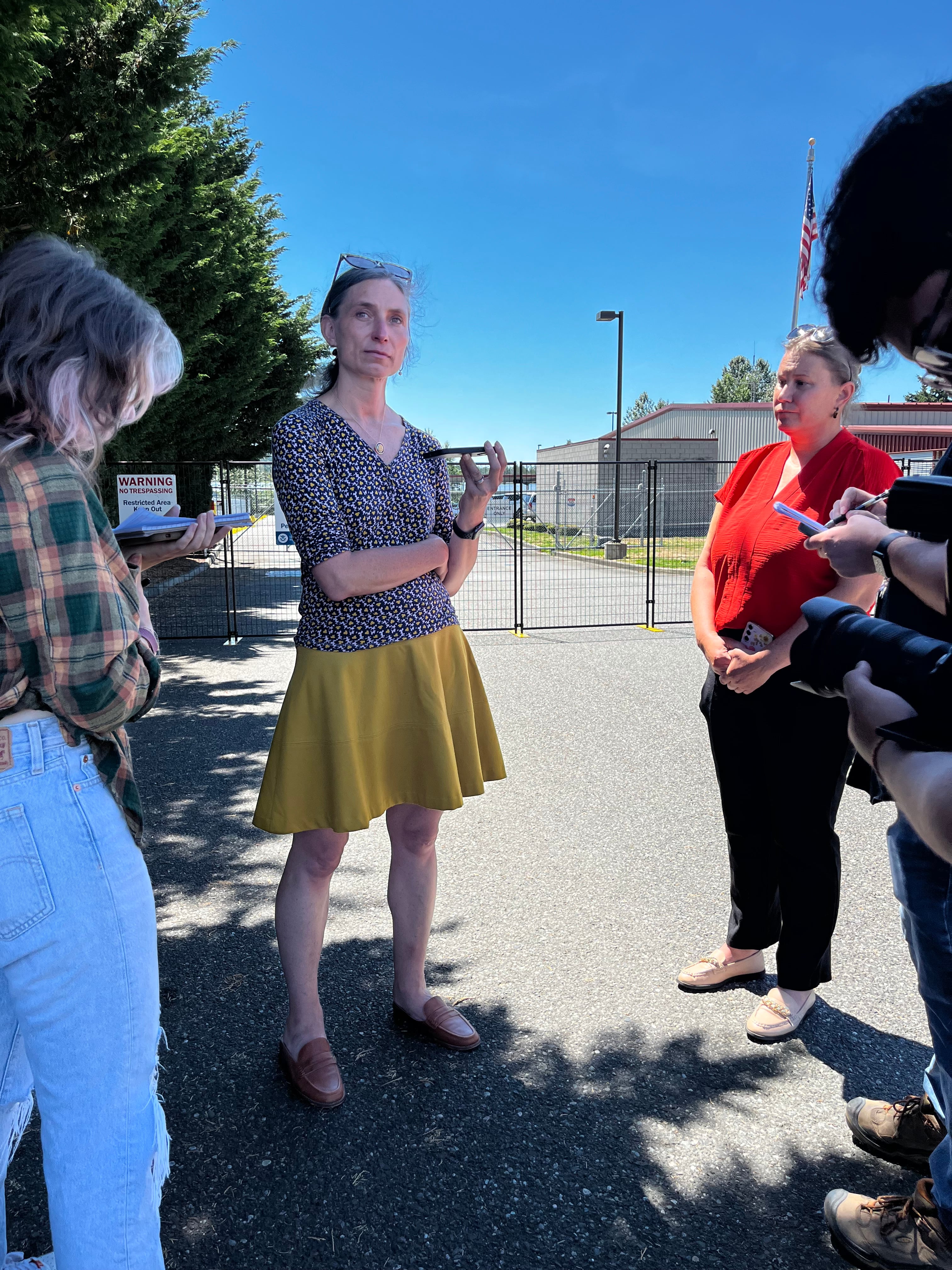 U.S. Rep. Maxine Dexter, D-Ore., speaks to reporters in front of the ICE facility near Ferndale, Wash., where Kenia Jackeline Merlos and her four children have been detained.