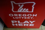 A sign for the Oregon Lottery is seen at a 7-Eleven on Friday, April 5, 2024, in Portland, Ore. A Powerball player in Oregon won a jackpot worth more than $1.3 billion on Sunday.