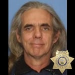 Police said Everett Scott Fuller, 55, is a "person of interest" and should be considered "armed and dangerous."