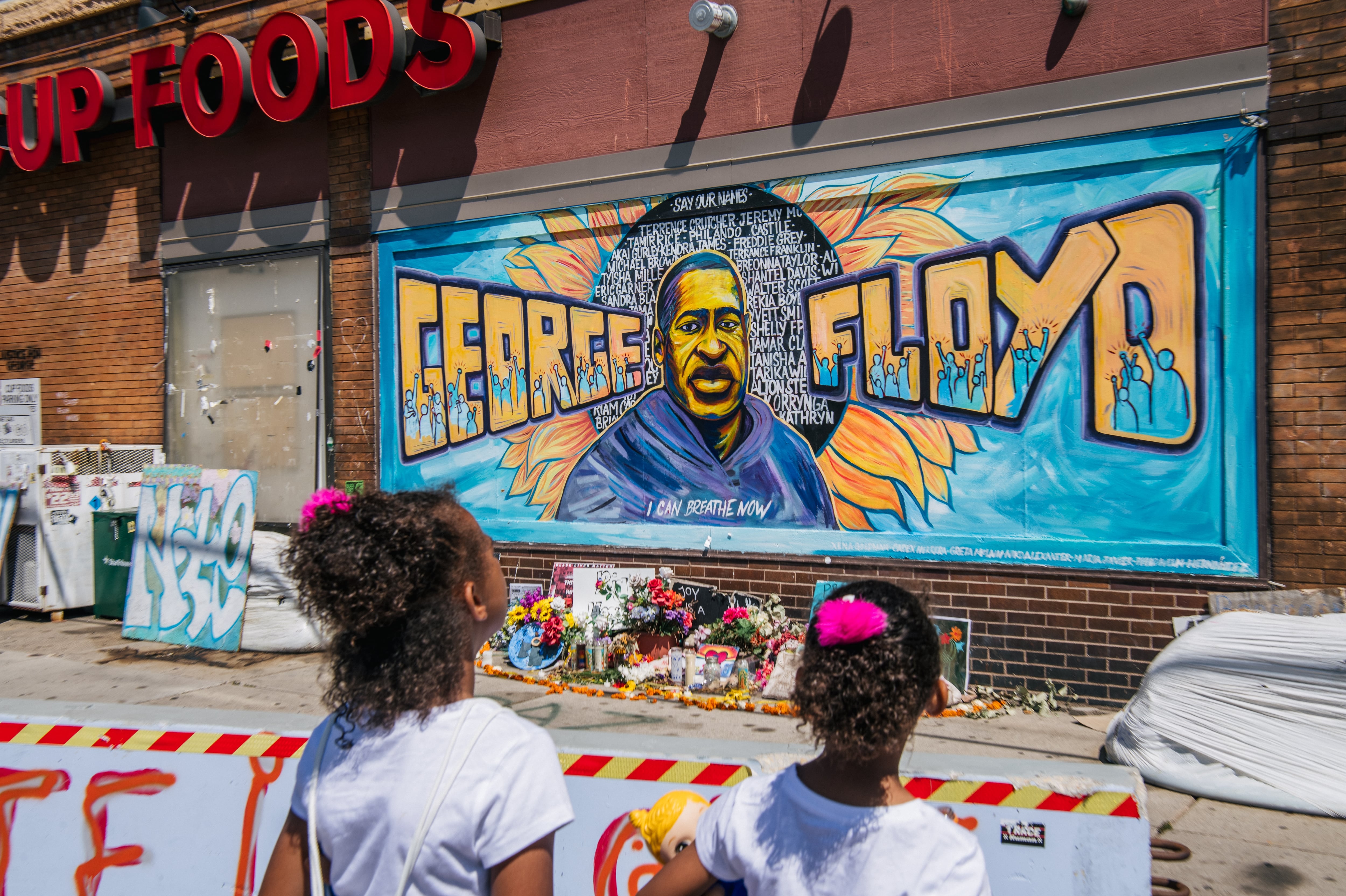 Jordan and Royal Pacheco learn of George Floyd's murder at the intersection of 38th Street and Chicago Avenue, ahead of former Minneapolis police officer Derek Chauvin's sentencing, on June 25, 2021 in Minneapolis, Minnesota.