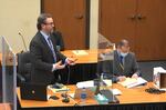 In this image from video, defense attorney Eric Nelson, left, accompanied by former Minneapolis police officer Derek Chauvin speaks as Hennepin County Judge Peter Cahill presides Monday, March 29, 2021, in the trial of Chauvin, in the May 25, 2020, death of George Floyd at the Hennepin County Courthouse in Minneapolis, Minn. (Court TV via AP, Pool)