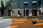 A person walks through the courtyard at Legin Commons on Sept. 10, 2026 in Portland, Ore. 
