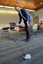 Adult services librarian Matt Neer steers a Finch robot at the Eugene Public Library.