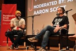 Joseph Fink (left) and Jeffrey Cranor (right), the creators of the podcast, "Welcome to Nightvale", and authors of the novel "It Devours!", onstage at Wordstock 2017.