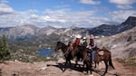 Riders from  a modern-day “Hen Party” admire the view over the Lakes Basin region of the Eagle Cap Wilderness.