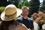 Maywood Park Mayor Matthew Castor speaks with a resident while he walks around the city on Saturday, July 20, 2019.