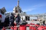 In this supplied photo, responders are shown suiting up at the Nippon Dynawave Packaging Co. incident, May 28, 2026, in Longview, Wash.
