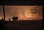 This photo supplied by Cody Masterson shows the Grasshopper Fire approaching Masterson's home, Aug. 10, 2026.