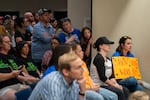 Attendees pack inside the meeting.