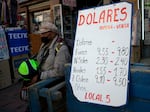 A sign displays currency exchange rates in La Paz on Friday, June 28, 2024.