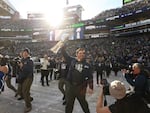 Seattle Seahawks Head Coach Mike Macdonald holds up the Vince Lombardi Trophy during a Super Bowl LX celebration at Lumen Field on Wednesday, Feb. 11, 2026.