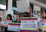 Protesters in Miami support a resolution in favor of reinstating temporary protected status for Venezuelans on Feb. 13, 2025. In early February, the Trump administration revoked temporary protected status for around 350,000 Venezuelans who fled the country and immigrated to the United States.