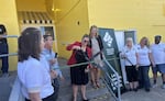 St. Vincent de Paul's Executive Director Bethany Cartledge cuts the ribbon at the opening of the Murnane Family Resource Center on July 8, 2026.