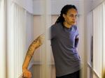 WNBA star and two-time Olympic gold medalist Brittney Griner, stands listening to a verdict in a courtroom in Khimki just outside Moscow, Russia, Thursday, Aug. 4, 2022. American basketball star Brittney Griner apologized to her family and teams as a Russian court heard closing arguments in her drug possession trial.