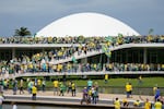 Protesters, supporters of Brazil's former President Jair Bolsonaro, storm the National Congress building in Brasilia, Brazil, Jan. 8, 2023.