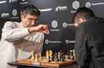 Chess Grandmasters Vladimir Kramnik (left) and José Martínez Alcántara face off at the World Chess Clash of Blames tournament on Aug. 19, 2024, in London. The International Chess Federation said Wednesday it is investigating Kramnik for allegations of cheating he levied at Daniel Naroditsky and other elite players.