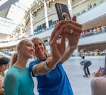 Nicole Weber, 15, left, and her mother Julie Weber take a photo together.