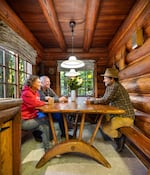 Author Ian McCluskey interviews the Doug and Laurie Dougherty in September 2024 in their family cabin, restored by Doug's mother, the late Nancy Dougherty. When Nancy moved into the cabin in the 1970s, the handmade dining table had been discarded in a snow bank. Today, the work of Henry Steiner is recognized for its historic and cultural significance.