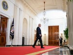 President Biden walks through the Cross Hall of the White House on July 1, 2024.