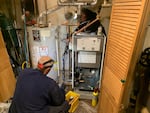 Oval Heating and A/C workers install a more efficient condensing gas boiler in a Sharon Hill, Pennsylvania home. New Department of Energy efficiency standards can only be met with these boilers or furnaces, which save customers about 15% on their gas utility bill.