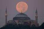 The sturgeon supermoon rises over the Ayasofya-i Kebir Camii, or Hagia Sophia Grand Mosque, in Istanbul on Wednesday.