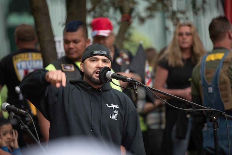 A 2017 file photo of Patriot Prayer leader Joey Gibson addressing a crowd at a rally and holding a moment of silence for the victims of the Portland MAX train stabbings.