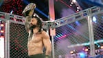 Roman Reigns holds up the WWE Universal Championship belt after defeating Jey Uso during an October 2020 match in Orlando, Fla.