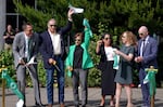 University of Oregon President Karl Scholz (far left) is joined by administrators and local and state leaders in a ribbon cutting ceremony for the university's new Portland campus on May 29, 2025.