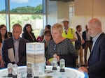 Granholm talks to executives from Albemarle, a maker of lithium, a vital component of electric vehicle batteries, in Kings Mountain, N.C. Pictured behind her is NPR reporter Camila Domonoske.