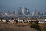 Homes sit on a hilltop with a view of the downtown Los Angeles skyline Thursday, June 10, 2021, in Los Angeles. (AP Photo/Jae C. Hong)