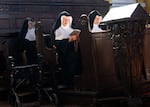 Sisters Rita (right), 81, Regina (left), 86, and Bernadette (center), 88, at the convent chapel of the Goldenstein castle south of Salzburg city, Austria on Sept. 20, 2025. Supporters of three nuns in their 80s flocked to the convent in a show of solidarity.