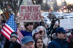 People protest against a funding freeze of federal grants and loans following a push from President Donald Trump to pause federal funding near to the White House in Washington on Tuesday, Jan. 28, 2025. Clackamas Women’s Services is one of the Oregon-based nonprofits that may be impacted by the freeze.