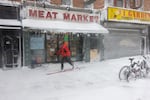 A man skis through the streets of Brooklyn as blizzard conditions continue on Feb. 23 in New York City.