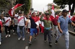 Anti-government protesters who traveled to the capital from across the country march against Peruvian President Dina Boluarte in Lima, Peru,  on Wednesday.