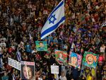 People protest against Prime Minister Benjamin Netanyahu's government and call for the release of hostages held in the Gaza Strip by the Hamas militant group, in Tel Aviv, Israel, Saturday, Aug. 31, 2024.