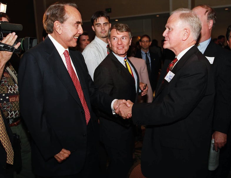 Former presidential candidate Bob Dole shakes hands with former U.S. Senator Bob Packwood, after an Oregon GOP fund-raiser, in Portland, Ore., Thursday, Sept. 25, 1997. Packwood, who resigned from the Senate in l995, says he's content with running his Washington, D.C., lobbying firm.