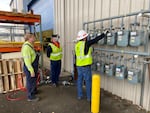 NW Natural employees Glenn Cavender, Clay Studtman and Bill Adler test blended hydrogen gas at the company's Sherwood facility.