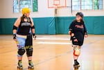 Kristen Owenreay, left, skates alongside Murphy James in Corvallis, Ore., on July 16, 2025.