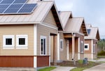 New energy-efficient and climate-resilient homes constructed by the Confederated Tribes of Grand Ronde, pictured here on Dec. 11, 2023, in Grand Ronde. Each of the 24 homes is equipped with solar panels, and features such as the metal roof, energy recovery ventilator and siding materials help make the homes wildfire resilient.