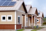 FILE - Energy Trust worked with the Confederated Tribes of Grand Ronde to build 24 energy-efficient homes for tribal elders. Technologies including electric appliances, solar panels, renewable energy storage batteries, electric vehicle chargers and heat pumps help lower demand on the grid and help cement regional energy efficiency goals.