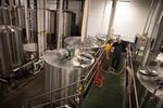 Brewers Zane Tarabochia-Martin and Jordan Davis start a batch of Worthy Brewing's Northwest IPA on Sept. 20, 2022, in Bend, Ore.