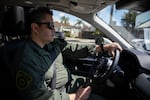 Wilson Linares, commander of the L.A. County law enforcement division of the California Department of Cannabis Control, heads to the location to serve a search warrant on an unlicensed cannabis store in Long Beach, Calif., on March 5, 2024.