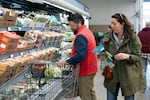 Rich Henderson and his wife, Rachel Negro-Henderson, grocery shop for their family at the Aldi in Bellmawr, New Jersey.