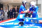 President Donald Trump speaks as (L-R) 2026 Indianapolis 500 winner Felix Rosenqvist, reigning IndyCar series champion Alex Palou and Freedom 250 Grand Prix Chairman Bud Denker look on at a Freedom 250 Grand Prix showcase outside the White House in July.