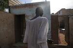 Ahmed Uduma says that bullets and shrapnel pierced his modestly sized brick bungalow — but he and the house survived.