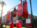 Red skirts are on display at the Arizona State Capitol in Phoenix, Wednesday, May 5, 2021, to raise awareness for missing and murdered Indigenous women and girls. Phoenix Indian Center Executive Director Patricia Hibbeler said the skirts are a huge part of the lives of Native American women and girls.