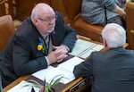 FILE: Republican state Sen. Lynn P. Findley, left, talks with Republican Sen. Bill Hansell on inauguration day at the Capitol in Salem, Ore., Jan. 9, 2023. Findley is one of nine Republican state senators who criticized Oregon's flagship climate program in a recent letter.