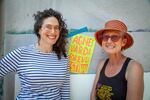 Laura Glazer and Jennifer JJ Jones stand next to their poster for the Agnes Varda Forever Festival being held at the Clinton Street Theater from Aug 19th - 31st.