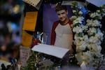 A picture of former One Direction singer Liam Payne adorns a memorial outside the hotel where he was found dead after falling from a balcony in Buenos Aires, Argentina, Thursday, Oct. 17, 2024.