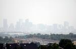 Haze hangs in the air over downtown Denver, Wednesday, July 24, 2024. Fires burning in California, Oregon, Arizona, Washington and other western states, as well as Canada, have filled the skies in regions of the western U.S. with smoke and haze, forcing some affected areas to declare air quality alerts or advisories.